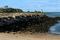 Breakwater at Low Tide Leads to Black Rock Harbor Light